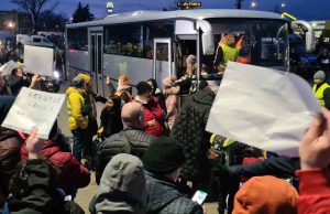 Ukrainians in Poland boarding a bus to Denmark